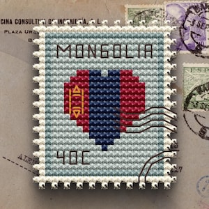 May include: A cross-stitched postage stamp featuring the word "MONGOLIA" in brown letters. The stamp has a heart design in red, blue, and yellow. The stamp also has the number "40C" in the bottom corner.