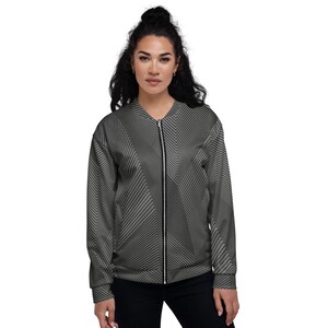 May include: A gray bomber jacket with a black chevron pattern. The jacket has a zipper closure and a ribbed collar, cuffs, and hem.