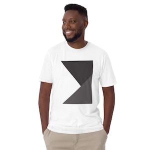 May include: A white t-shirt with a black and gray geometric design on the front. The design is a triangle shape with two different shades of gray.