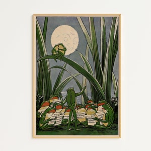 May include: A framed vintage illustration shows green frogs singing from sheet music under a full moon. The artwork features tall green reeds and a serene, whimsical atmosphere, with a light blue sky.