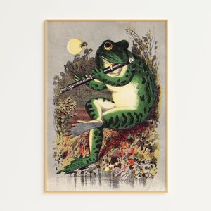 May include: A green frog playing a flute in a whimsical illustration. The frog is sitting on a rock surrounded by flowers and leaves. The background is a light blue sky with a moon.