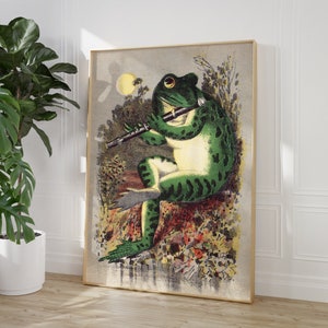 May include: A green frog playing a flute in a whimsical illustration. The frog is sitting on a rock with flowers and leaves around it. The background is a light blue sky with white clouds.