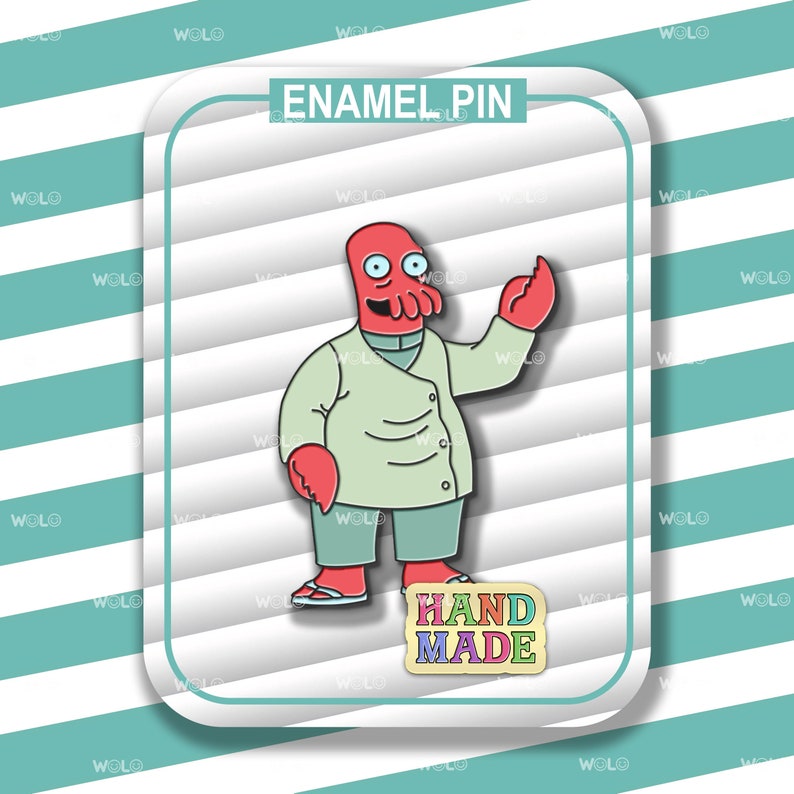 May include: Enamel pin featuring a cartoon character with a red head and arms, wearing a light green coat and pants. The pin includes the text "HAND MADE" and "ENAMEL PIN". The background has a white and teal striped pattern.
