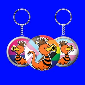 Doctor Who Pin & Schlüsselanhänger – Dugga Doo Pride | LGBTQ+ Dr Who Fan Geschenk | Whovian Pin Button 38 mm | Sammlerstück, Geburtstag, Weihnachten