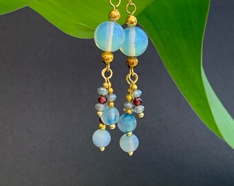 pair of whimsical misty blue and gold opalite earrings with garnet, gold plated gemstone long dangle earrings