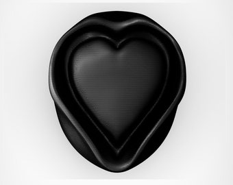 Pode incluir: Um objeto preto em forma de coração com uma superfície texturizada em relevo. O coração é rodeado por uma borda preta.