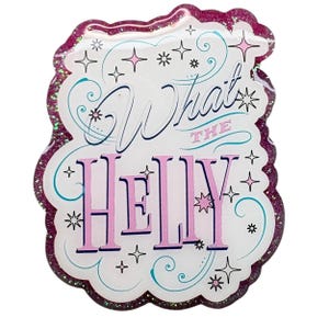May include: A decorative pin with a glittery, scalloped edge. The pin features the phrase "What the Helly" in a whimsical font, with stars and swirls. The text is in pink and blue against a white background.