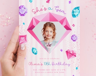 May include: A rectangular birthday invitation card featuring a pink striped background with scattered illustrations of colorful gemstones. The center displays a large pink diamond shape containing a photograph of a child. Text reads: She's a Gem, Join us to celebrate, Olivia's 10th Birthday, SAT. FEBRUARY 14TH AT 2 PM. MAGENTA GARDEN NEW YORK, RSVP by Jan. 8th at 123-456-7896.