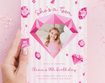 May include: A rectangular birthday invitation card featuring a pink striped background with scattered pink diamond illustrations and glitter accents. The text reads She's a Gem, Olivia's 8th Birthday, Sat. February 14th at 2 PM, Magenta Garden New York.