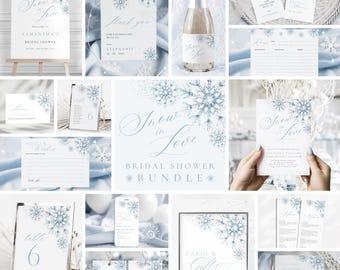 May include: A collection of light blue and white bridal shower stationery with snowflake designs. Includes a welcome sign, thank you cards, table number, advice cards, gift cards, and a champagne bottle label. The theme is "Snow in Love".
