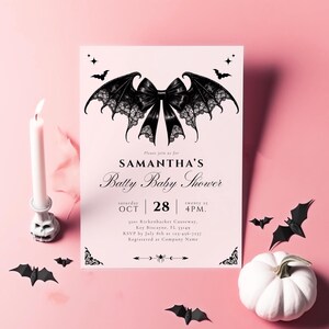 May include: A pink baby shower invitation with a black bat-wing bow design. The invitation reads "SAMANTHA'S Batty Baby Shower" with the date and time. Decorative bats and a white pumpkin are scattered around the invitation.