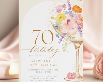 May include: A 70th birthday invitation card featuring a watercolor illustration of a cocktail glass filled with colorful flowers. The text reads 70 birthday, Stephanie's 70th Birthday, Saturday, October 26th, 12 PM - 2 PM, and address details.