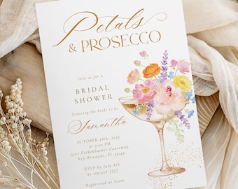 May include: A white invitation card with gold script that reads "Petals & Prosecco" and "Bridal Shower." It features a watercolor illustration of flowers in a champagne glass. The date, time, and location are also included.