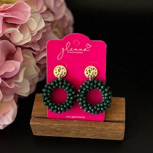 Dark green faceted pearl statement earrings, round