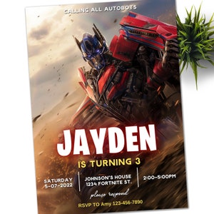 Könnte beinhalten: Eine Geburtstagseinladung mit einem roten und blauen Robotercharakter, oben der Text "Calling all Autobots" und in der Mitte "Jayden is turning 3". Die Einladung enthält Details zur Party, einschließlich Datum, Uhrzeit und Ort.