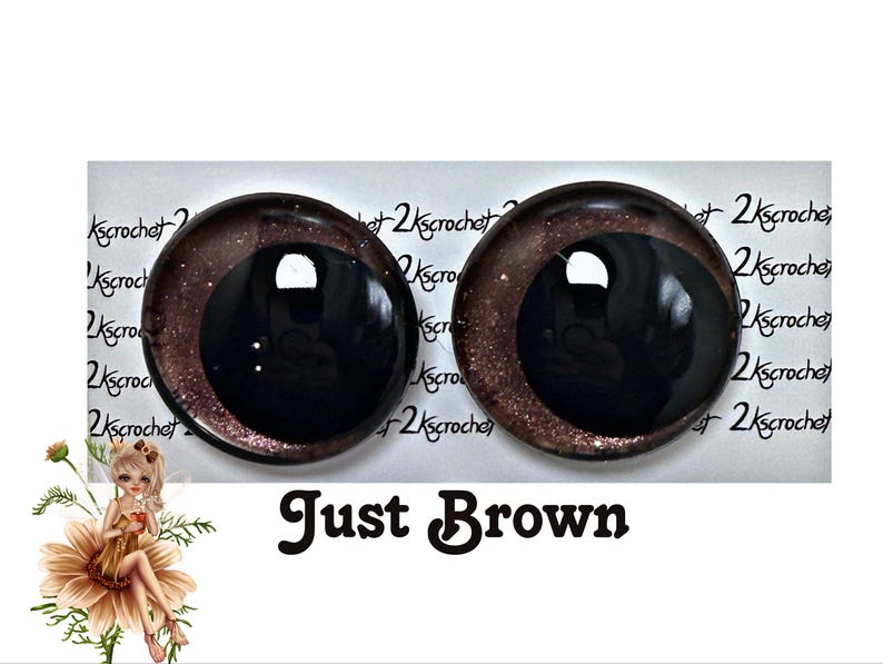 May include: Two brown and black safety eyes with a glitter finish. The eyes are approximately 1 inch in diameter.