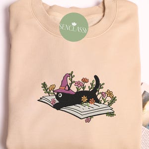 Embroidered Cat Lying On The Book With Witch Hat Sweatshirt, Floral Cat Book, Flower With Cat Book Lover Shirt, Bookish Gift, Cat Lover Gift