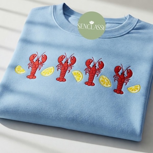 ロブスターレモン刺繍スウェットシャツ、マリンテイストのコースタルパーカー、ミニマルなシーフードラバーシャツ、サマービーチTシャツ、漁師の美的ギフト