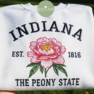 May include: White sweatshirt with embroidered text "INDIANA EST. 1816 THE PEONY STATE" and a pink peony flower.
