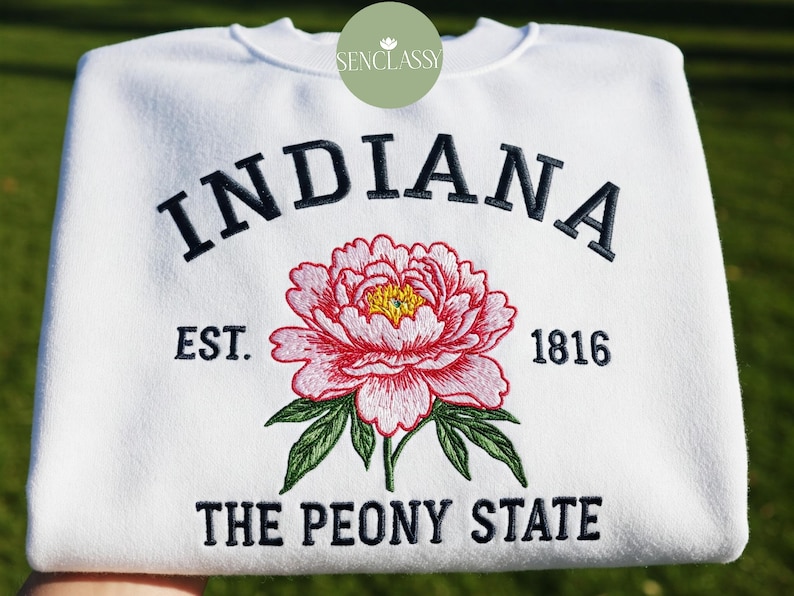May include: White sweatshirt with embroidered text "INDIANA EST. 1816 THE PEONY STATE" and a pink peony flower.