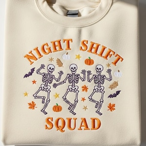 Night Shift Crew Halloween Nurse Embroidered Sweatshirt – Retro Spooky Skeleton RN Shirt – Funny Medical Staff Halloween Costume Tee