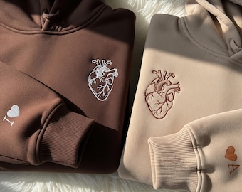 Custom Embroidered Couple Sweatshirt With Anatomical Heart & Sleeve Initials, Personalized Matching Hoodie Gift For Anniversary Hoodie