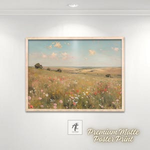May include: A framed landscape print featuring a field of wildflowers under a blue sky with fluffy clouds. The artwork has a light wooden frame and the text "Premium Matte Poster Print" is visible.