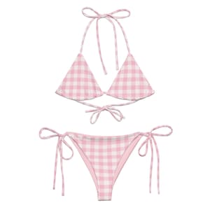 May include: Pink and white gingham bikini with a triangle top and a tie-side bottom.