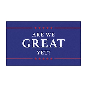 May include: A blue doormat with red and white stars and the text "ARE WE GREAT YET?"