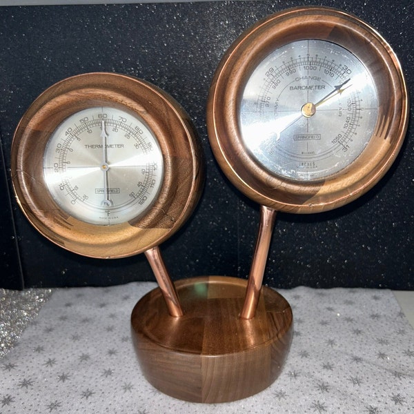 Decorative hand turned wooden cases with a Barometer and Thermometer mounted in them. Would make an excellent gift.