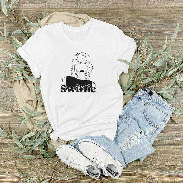 In the style of Taylor Swift unofficial unbranded inspired t-shirt, merch shirt, concert shirt, tee, TS eras tour