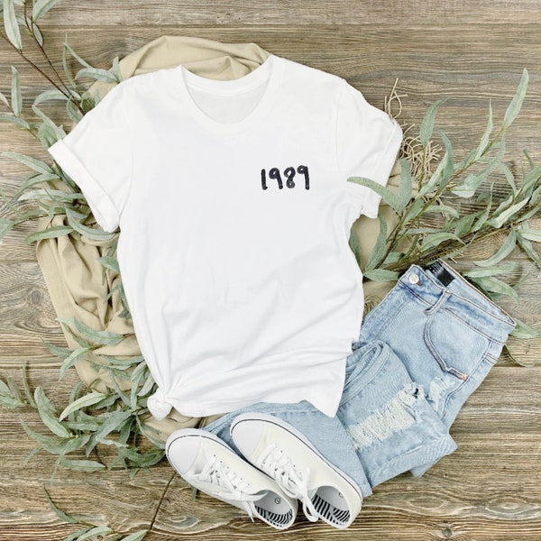 In the style of Taylor Swift unofficial unbranded inspired 1989,  Album title 1989, T-shirt, merch shirt, concert shirt, tee, TS eras tour