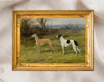 May include: A framed painting featuring two greyhounds in a grassy field. One dog is tan, the other is white with black markings. The painting has a gold ornate frame and a landscape background with trees and a cloudy sky.