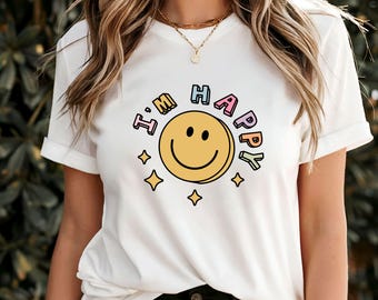 Camiseta con frase "Estoy feliz", camiseta con afirmación positiva, camiseta motivadora y motivadora, prenda alegre para el cuidado personal, camiseta con frase "Feliz", idea de regalo para sentirse bien