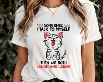 May include: White t-shirt featuring a cartoon cat and the text "Sometimes I talk to myself. Then we both laugh and laugh."