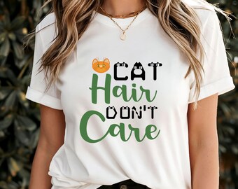 May include: White t-shirt with a green and black graphic that says "Cat Hair Don't Care". The graphic includes a cartoon cat face.