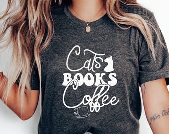 猫と本とコーヒーのTシャツ、かわいい猫好きのグラフィックTシャツ、心地よい読書好きのアパレル、猫好きのお母さんへのプレゼントに最適、トレンディなコーヒー好きのシャツ