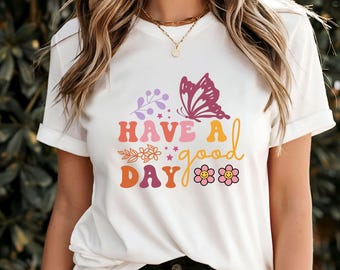 Camiseta con frase "Que tengas un buen día", camiseta con frase motivadora positiva, camiseta con mensaje diario alentador, ropa inspiradora para el cuidado personal, regalo considerado