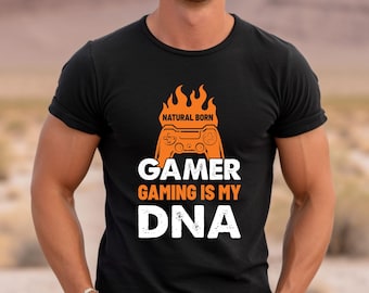 May include: Black t-shirt with an orange graphic of a video game controller with flames and the text "Natural Born Gamer Gaming Is My DNA".