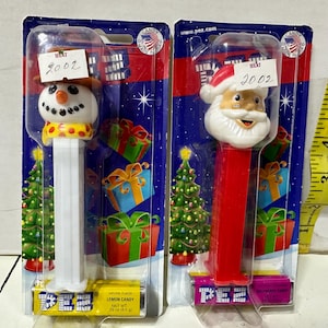 2 Christmas PEZ Dispensers. From 2002. Santa Claus and Elf