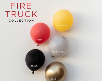 Puede incluir: Cinco globos de diferentes colores: rojo, negro, gris claro, dorado y amarillo dorado. Los globos están dispuestos en círculo sobre un fondo blanco. El texto "FIRE TRUCK COLLECTION" está en la parte superior de la imagen. El texto "DREAM + air" está en la parte inferior de la imagen.