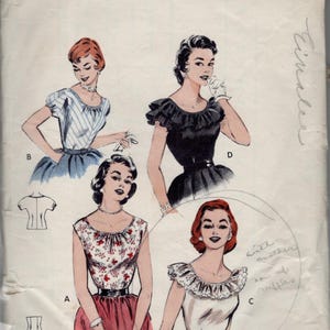 May include: A vintage Butterick 6927 printed sewing pattern envelope for size 14, bust 32. The front displays four illustrations of blouses with varying necklines, sleeve lengths, and ruffle details, labeled A, B, C, and D, with the text Quick and Easy.