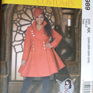 May include: McCall's Costumes pattern M7989. The image shows a woman wearing a red coat with gold buttons and a matching hat. The pattern includes sizes 26W-32W. The pattern is for costumes.