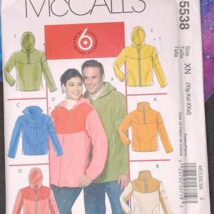 May include: A McCall's sewing pattern envelope featuring illustrations of hooded jackets in various colors: green, yellow, blue, orange, and pink. The pattern number is M5538, with the size listed as XN (Xlg-Xxl-XXxl). The text "6 Great Looks, One Easy Pattern" is also visible.