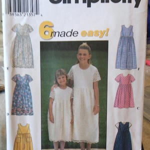 May include: Simplicity sewing pattern featuring six dress designs for sizes HH 3, 4, 5, and 6. The cover shows two girls in white dresses, with illustrations of various dress styles in blue, pink, yellow, and navy.