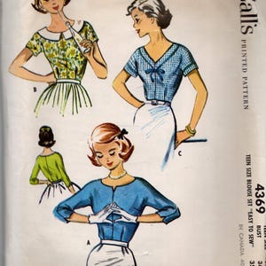 May include: Vintage McCall's Teen Size Blouse Set sewing pattern. The illustration shows three different blouse designs. The pattern includes the text "EASY" and the number "4369".