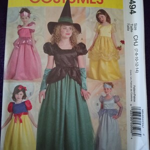 May include: A sewing pattern for five different children's costumes. The costumes include a witch, a princess, a Snow White, a Cinderella, and a Belle. The pattern is for sizes 7-8, 10-12, and 14. The pattern number is M5494.