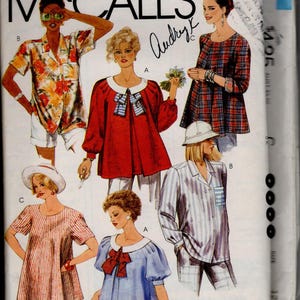 May include: A McCall's sewing pattern envelope featuring illustrations of various tops and shirts. Designs include a floral print button-down, a red blouse with a white collar and bow, a plaid tunic, a striped short-sleeve top, and a striped button-up shirt.