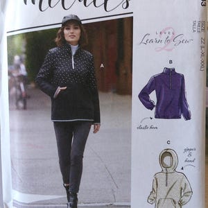 May include: McCall's sewing pattern M8143. The pattern includes instructions for a zip-up jacket with options for a hood and elastic hem. The cover features a woman wearing a black jacket with white polka dots. The pattern is labeled "Learn to Sew."