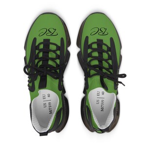 May include: A pair of green athletic shoes with black accents and laces. The shoes have the letters "BC" in black script on the top. The size is US M7/F9, EU 40.